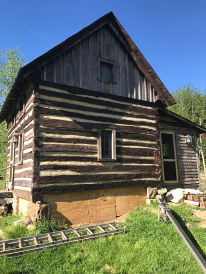 Chink Repair on Vintage Log Building Services 